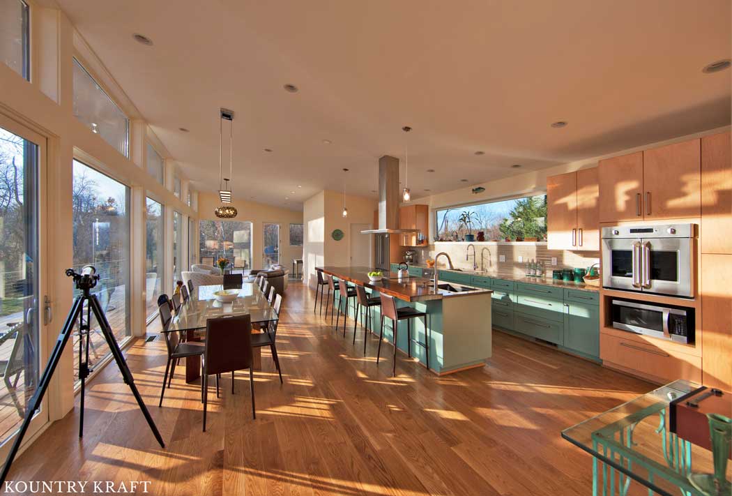 This Kitchen Features a Single Wall Layout and Green Colored Cabinets This Contemporary Kitchen Features a Single Wall Layout and Green Colored Cabinets and Kitchen Island